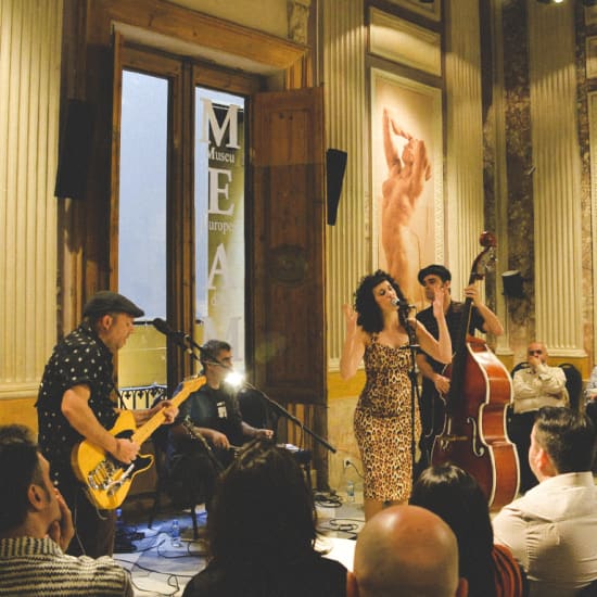 Cartel oficial del evento Friday's Blues y visita al MEAM, el Museo Europeo de Arte Moderno